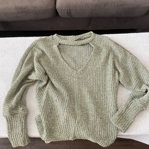 Green sweater with front opening.